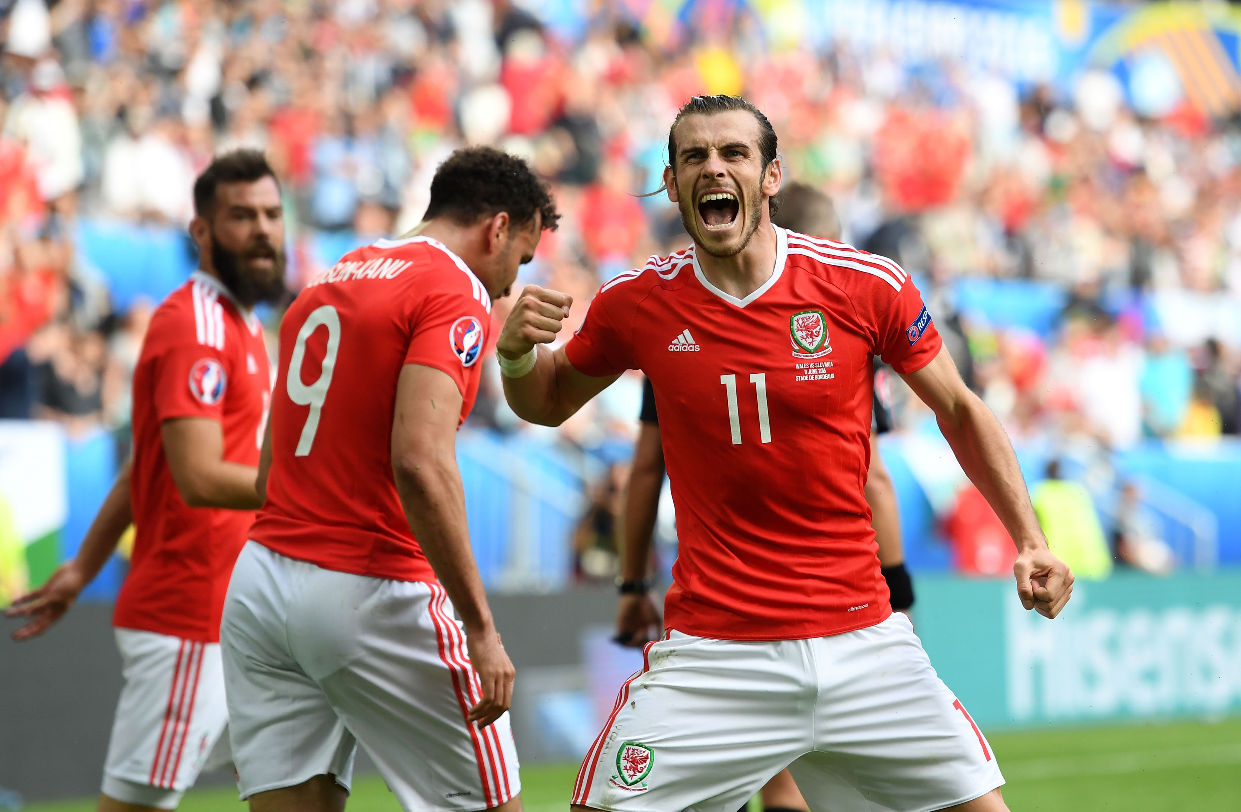 BORDEAUX, FRANCE - JUNE 11: Gareth Bale (R) of Wales celebrates his team's second goal scored by Hal Robson-Kanu (C) during the UEFA EURO 2016 Group B match between Wales and Slovakia at Stade Matmut Atlantique on June 11, 2016 in Bordeaux, France.  (Photo by Stu Forster/Getty Images)